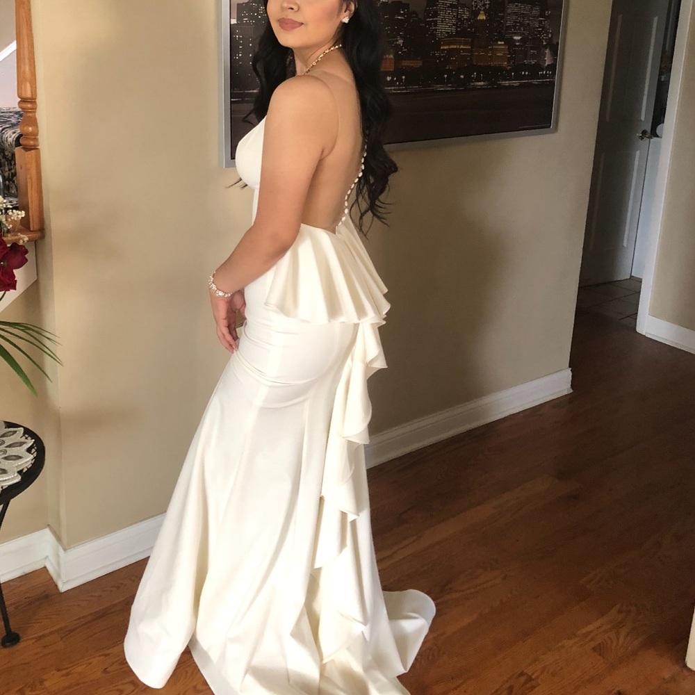 Janique ruffle train, open back prom dress.